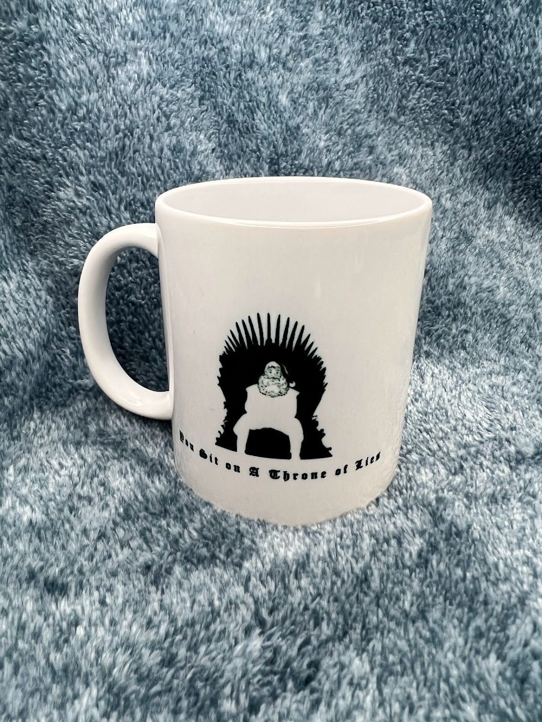 You Sit on a Throne of Lies Mug